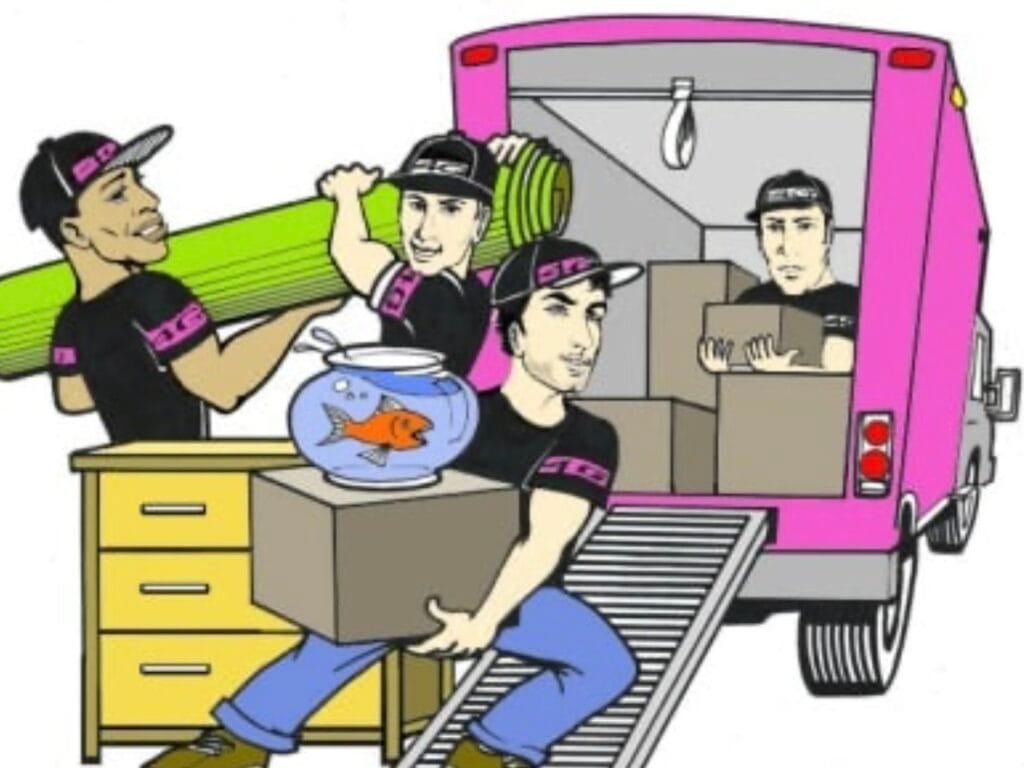 Alt text: "Four men working together to load boxes and furniture into a moving truck, showcasing teamwork and effort during the moving process."