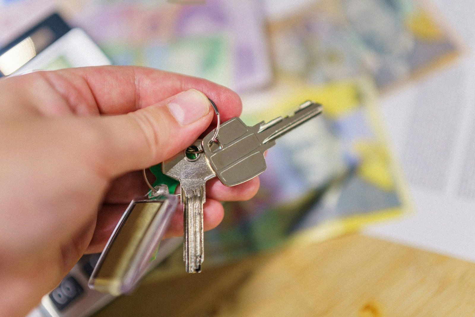 A person holding a bunch of keys in their hand