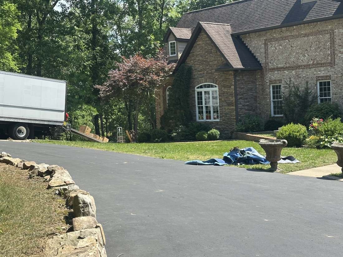 Get a moving quote Nashville TN - JM Moving truck loaded and ready at a Nashville home