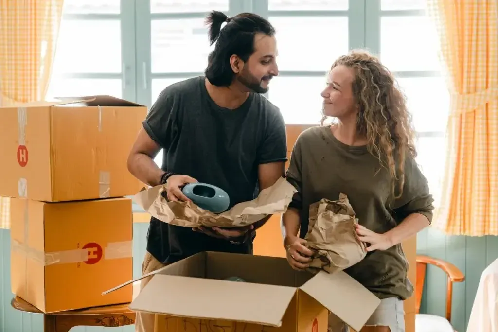 Nashville local moving services crew wrapping and protecting furniture