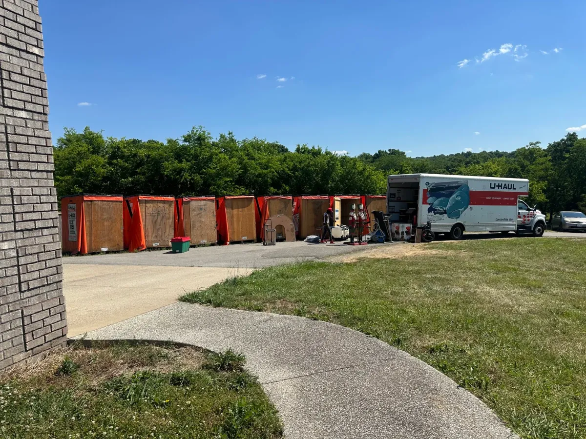 Moving truck and storage containers staged for a move to Nashville
