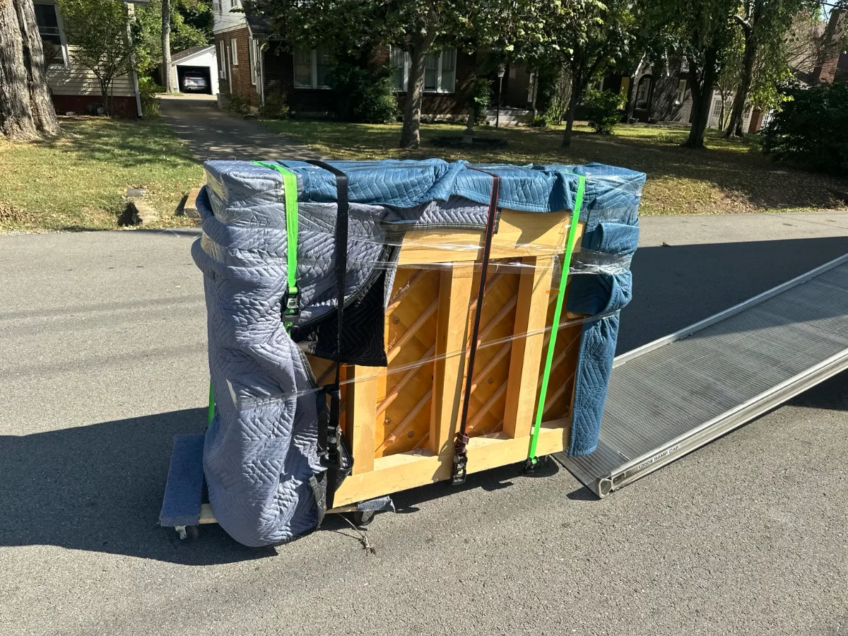 Back of upright piano protected by JM Moving Nashville