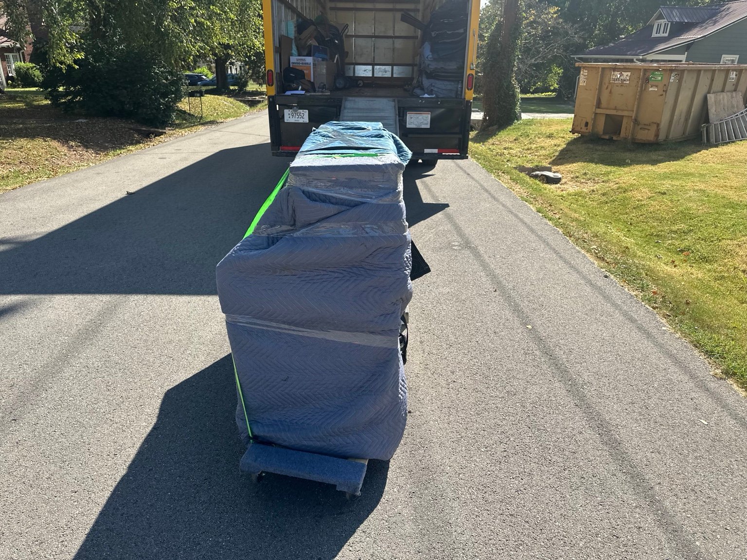 JM Moving loading protected piano into moving truck in Nashville
