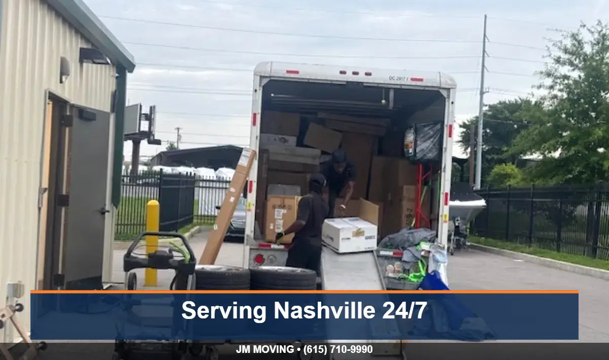 JM Moving crew loading a box truck at a Nashville storage building